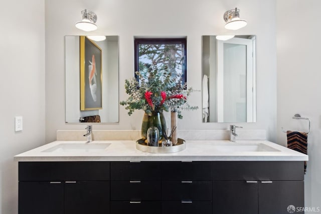 full bath featuring double vanity and a sink