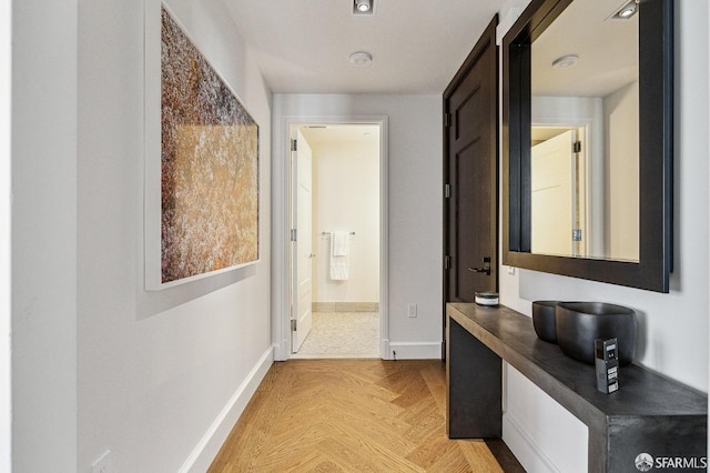 hallway with light parquet flooring