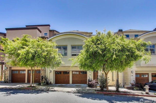 165 Summit Way, San Francisco, CA 94132 - obstructed view of property with an attached garage and stucco siding