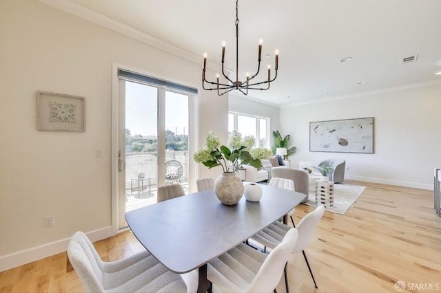 165 Summit Way, San Francisco, CA 94132 - dining area featuring a chandelier, ornamental molding, baseboards, and light wood-style flooring