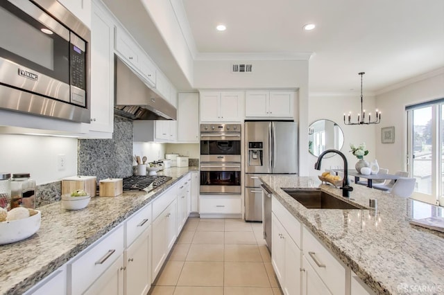 165 Summit Way, San Francisco, CA 94132 - kitchen featuring appliances with stainless steel finishes, under cabinet range hood, a sink, crown molding, and white cabinetry