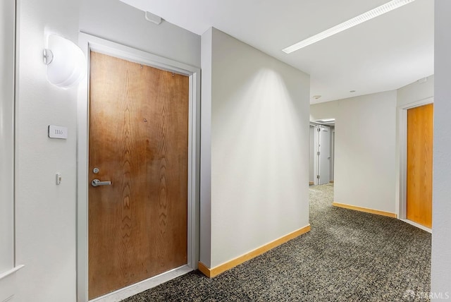 1 Daniel Burnham Ct Unit 1116, San Francisco, CA 94109 - hallway with baseboards and carpet flooring