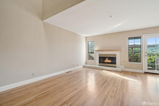 unfurnished living room featuring light wood-type flooring