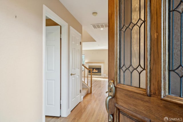 corridor featuring light wood-type flooring