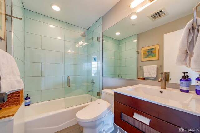 full bathroom with visible vents, shower / bathing tub combination, toilet, vanity, and recessed lighting