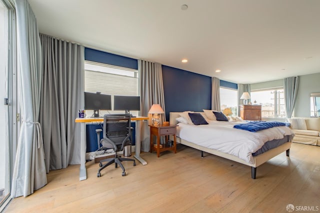 bedroom featuring wood finished floors and recessed lighting