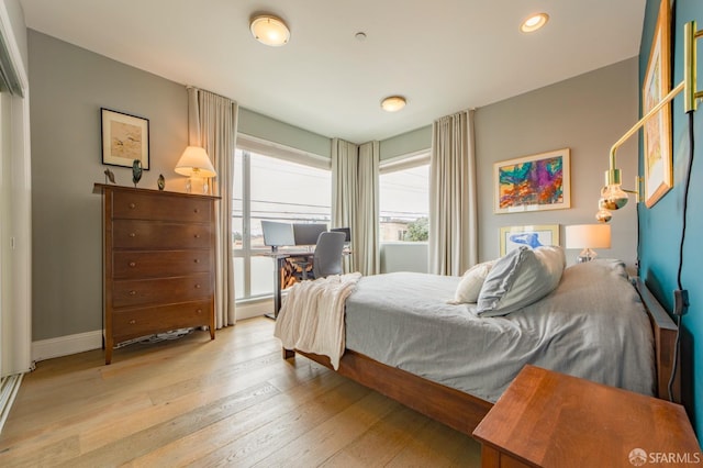 bedroom featuring recessed lighting, baseboards, and hardwood / wood-style floors