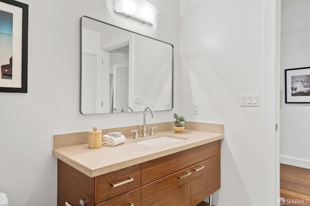 bathroom with a wall mounted AC and vanity