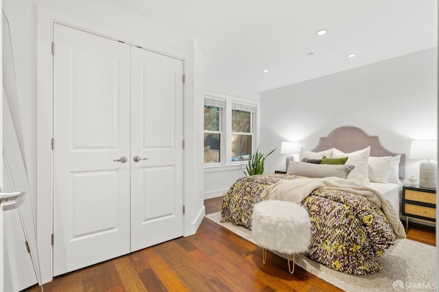 bedroom featuring a closet and hardwood / wood-style flooring