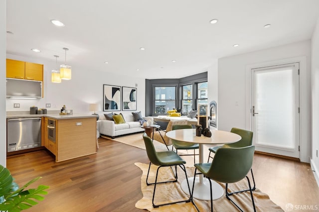 dining space featuring light hardwood / wood-style floors