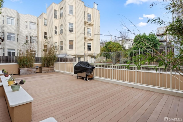 wooden deck featuring grilling area