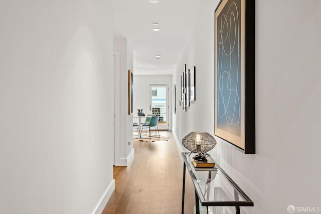 hallway featuring hardwood / wood-style flooring