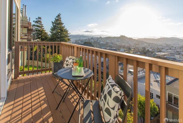 wooden terrace featuring a mountain view