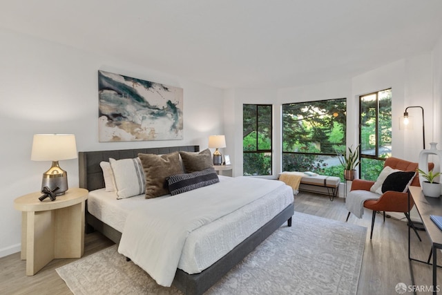 bedroom with light hardwood / wood-style flooring