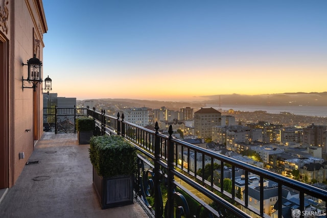 view of balcony at dusk