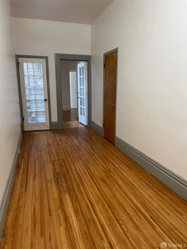 spare room with light hardwood / wood-style floors