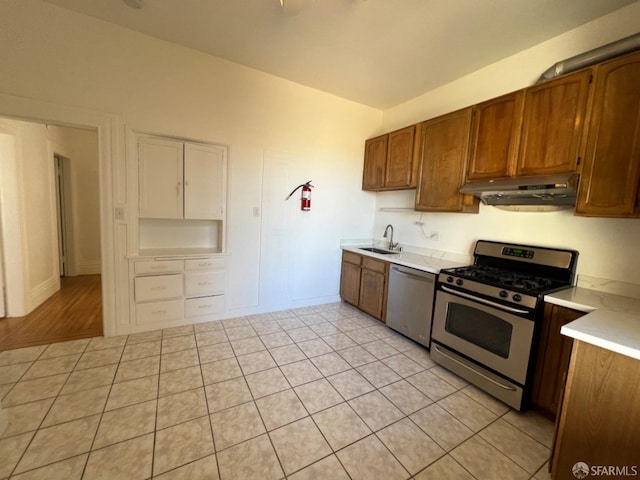 kitchen featuring light hardwood / wood-style floors, appliances with stainless steel finishes, and sink