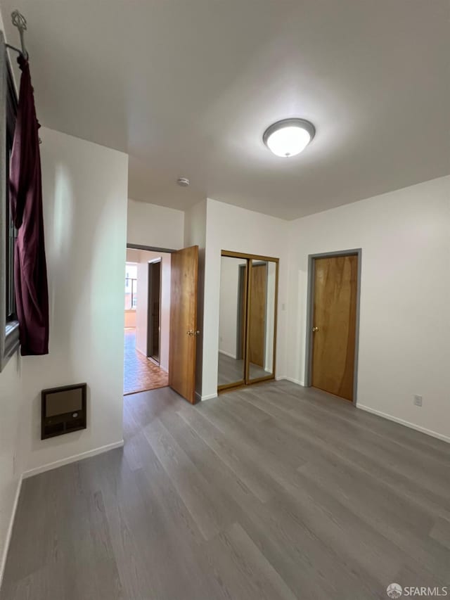 spare room featuring hardwood / wood-style floors