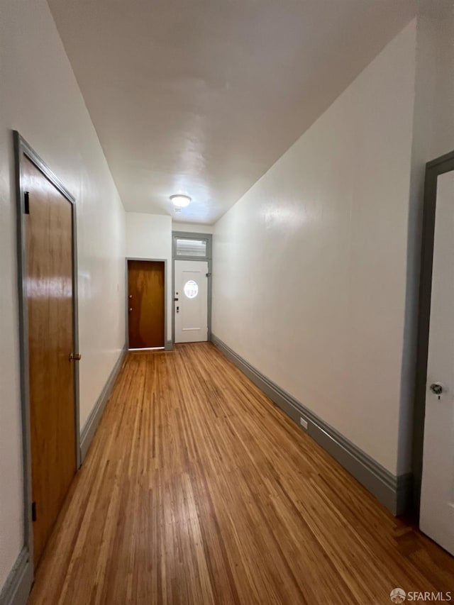 additional living space with light wood-type flooring