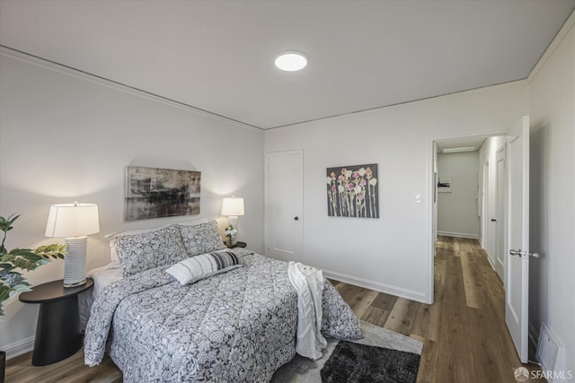 bedroom featuring wood-type flooring