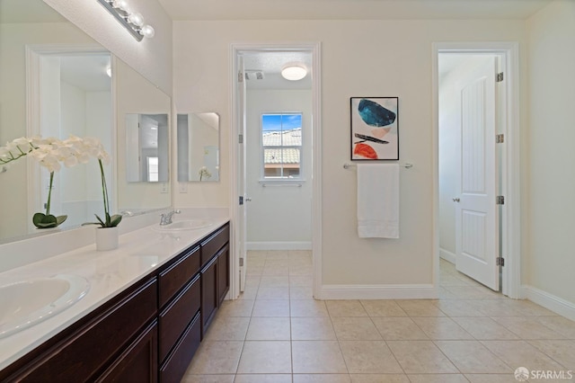 bathroom featuring tile patterned flooring and vanity