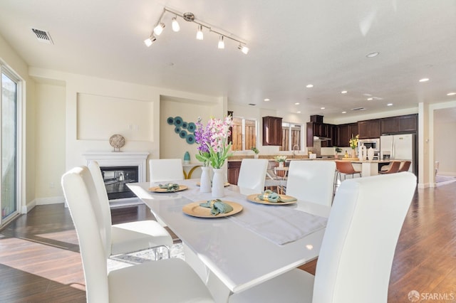 dining space featuring dark hardwood / wood-style floors