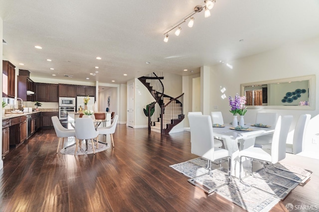 dining room featuring dark hardwood / wood-style flooring and sink