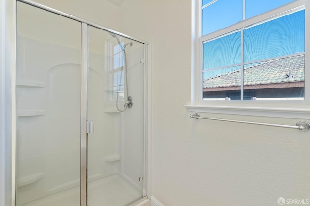 bathroom featuring an enclosed shower