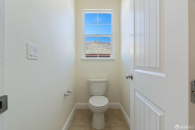 bathroom featuring tile patterned flooring and toilet