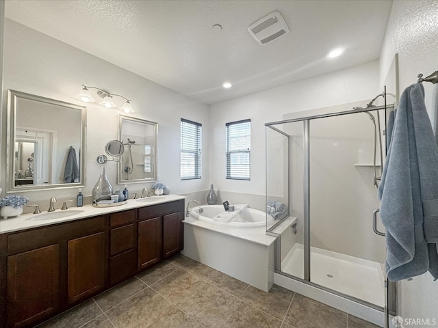 bathroom with vanity, shower with separate bathtub, and tile patterned flooring