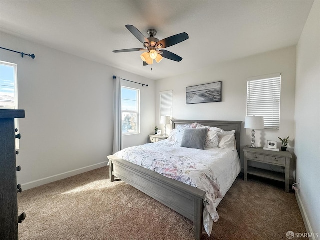 bedroom with dark carpet and ceiling fan