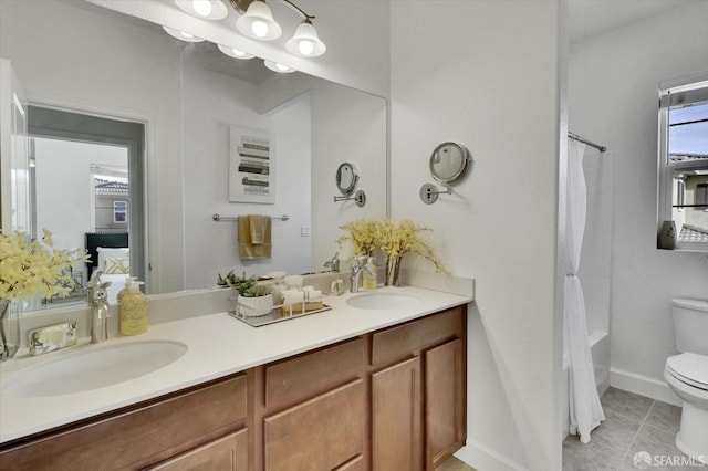 full bathroom with vanity, toilet, tile patterned flooring, and shower / tub combo