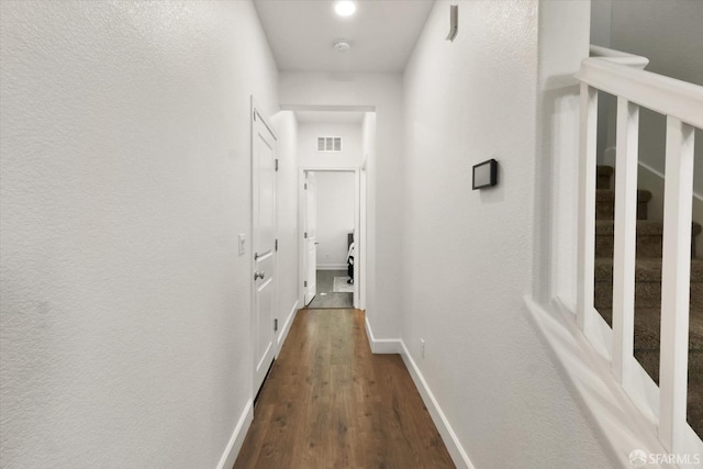 hallway featuring hardwood / wood-style flooring