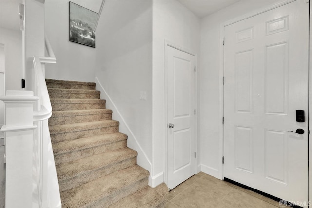 foyer entrance featuring light tile patterned floors