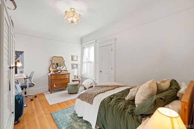 bedroom with hardwood / wood-style floors