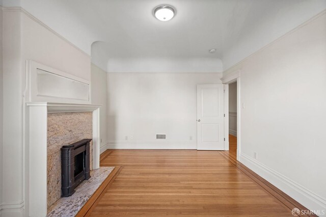 unfurnished living room featuring hardwood / wood-style floors