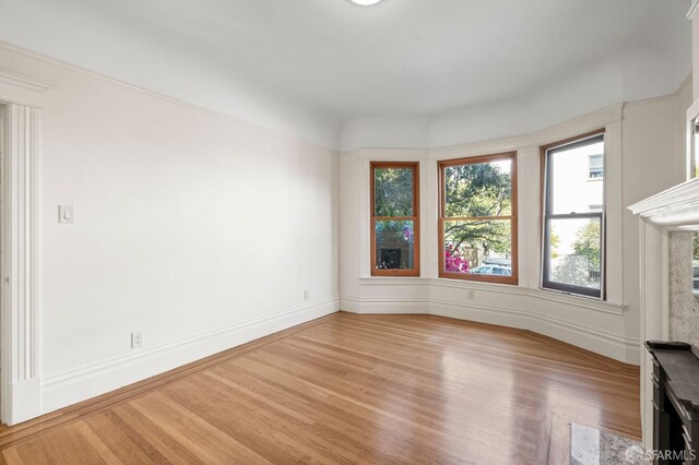 spare room featuring hardwood / wood-style floors