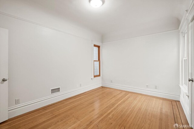 empty room featuring hardwood / wood-style flooring