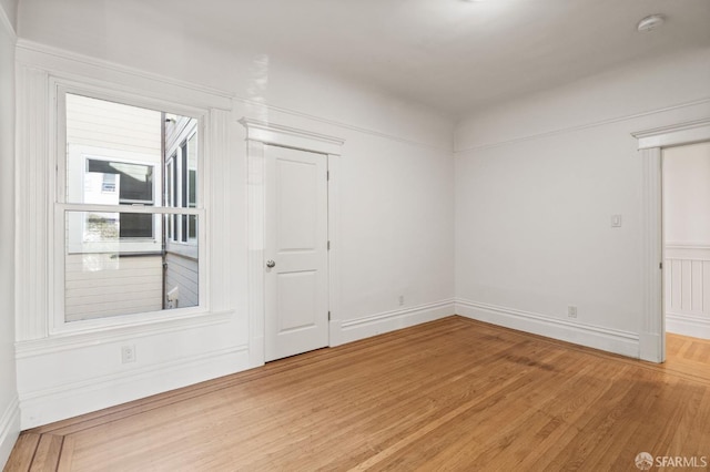 empty room featuring wood-type flooring