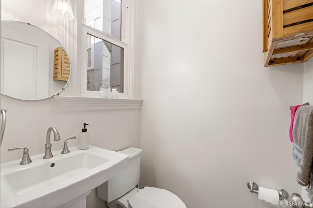 bathroom featuring toilet and sink