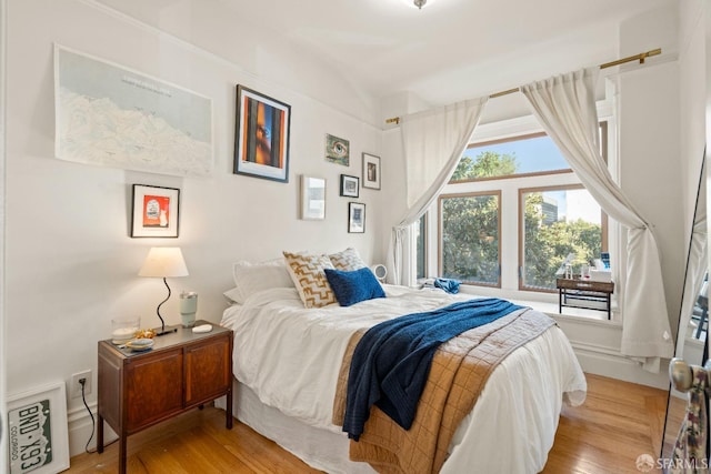 bedroom with light hardwood / wood-style floors