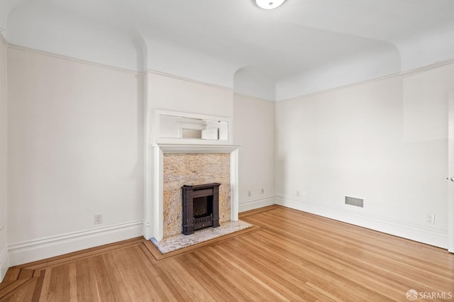 unfurnished living room featuring wood-type flooring