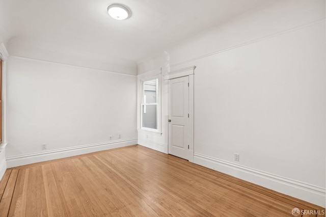 empty room with wood-type flooring