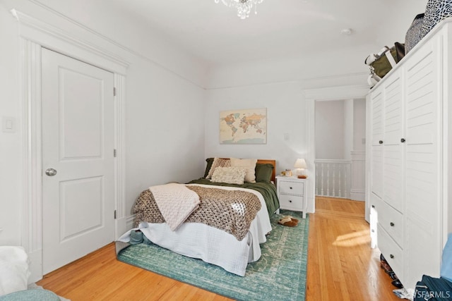 bedroom featuring hardwood / wood-style floors and a closet