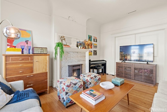 living room with light hardwood / wood-style flooring