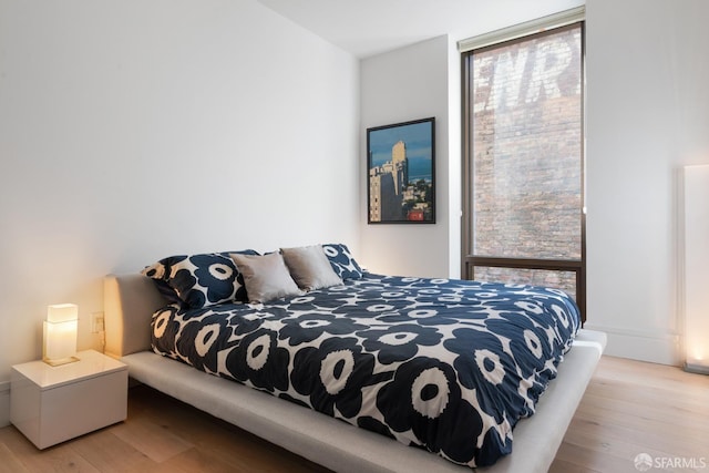 bedroom featuring light wood-style floors