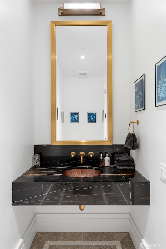 bathroom featuring visible vents and vanity