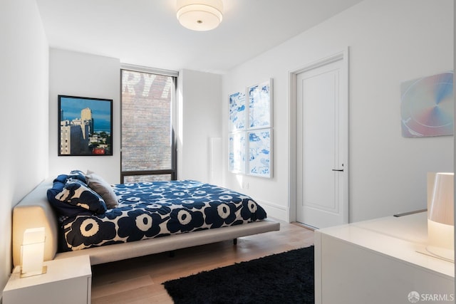 bedroom featuring wood finished floors