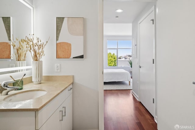 451 Kansas St Unit 428, San Francisco, CA 94107 - bathroom with vanity, wood finished floors, ensuite bath, and recessed lighting