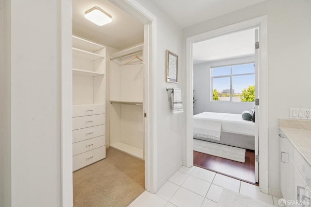 451 Kansas St Unit 428, San Francisco, CA 94107 - ensuite bathroom with vanity, tile patterned floors, and a spacious closet